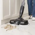 TESLA GlideStar GQ500 - mop spraying water onto dirt on the floor beside kitchen cabinets